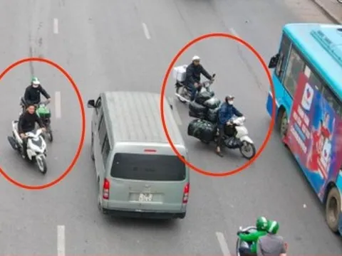 Xe máy nối đuôi nhau đi ngược chiều, cắt mặt ô tô trên đường Giải Phóng, Hà Nội