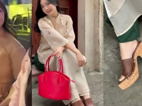 Vợ Hà Đức Chinh xinh đẹp trong áo dài Tết nhưng sự chú ý lại đổ vào vòng 2 vào đôi dép cao gót