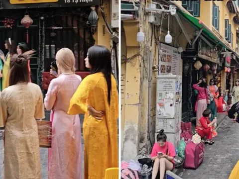 MXH nổ ra tranh cãi về trend chụp ảnh áo dài Tết: Buộc khăn, đeo kính đen và những cách tạo dáng gây khó chịu?